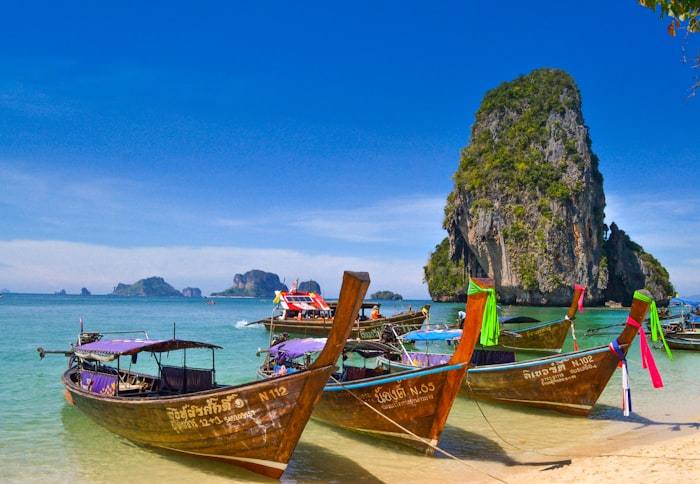 Longtail boats pulled up on the sand